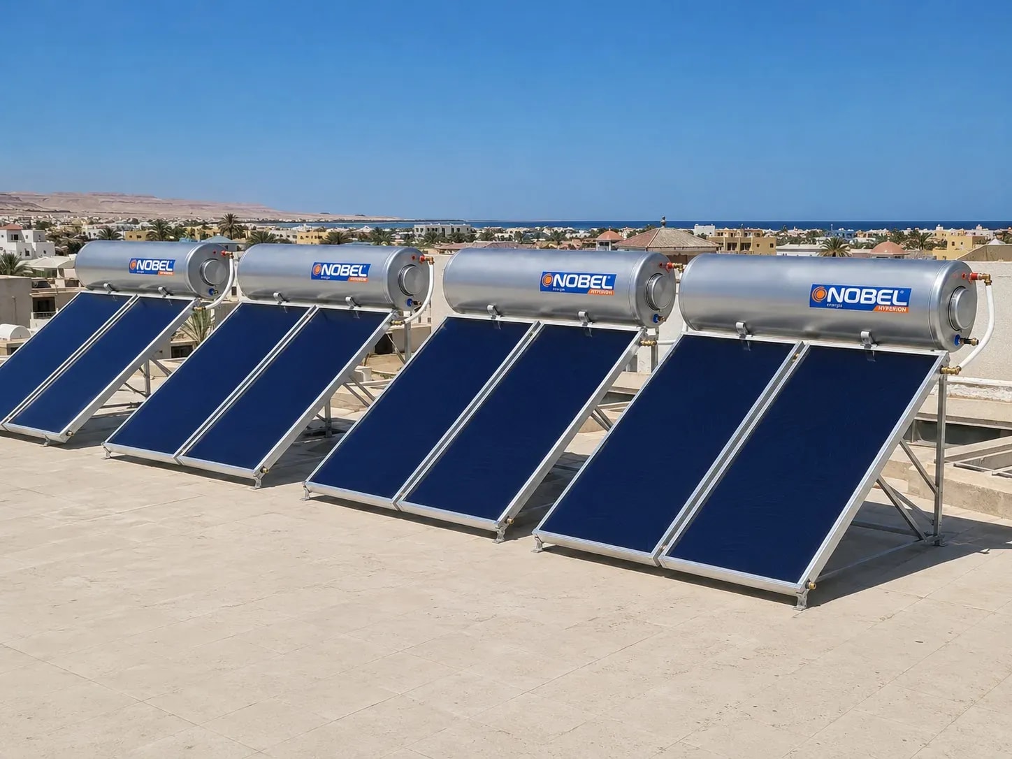 Five Nobel solar heaters in a row on a coastal building rooftop