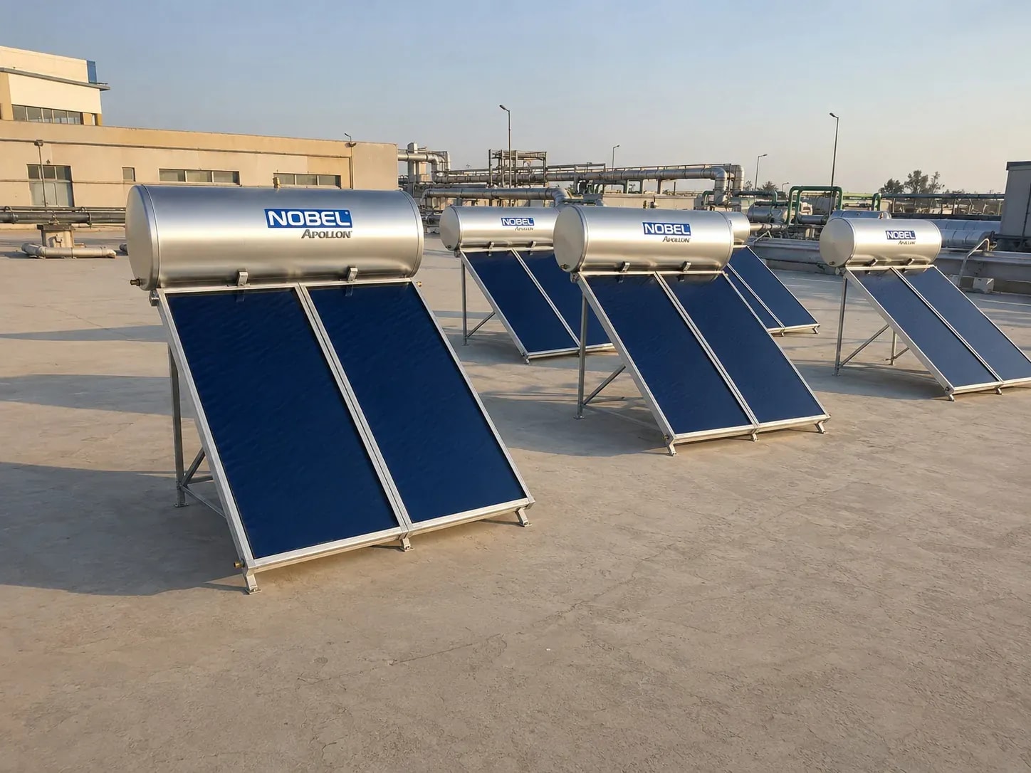 A row of heaters on an industrial facility rooftop with service pipework visible